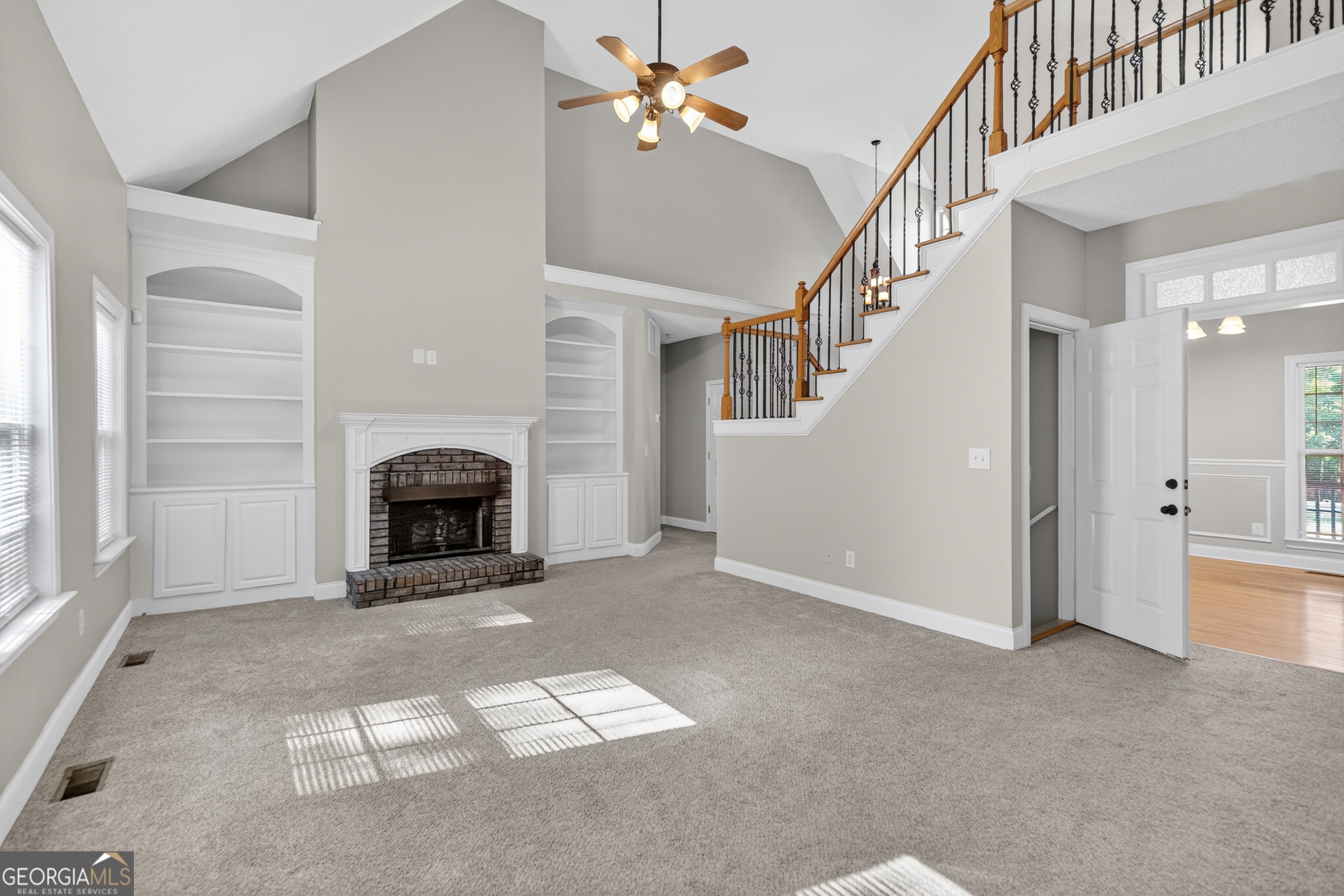 178 Rachel Boulevard Temple, GA 30179 - Photo 11 of 30 a view of an empty room with chandelier fan and fire place