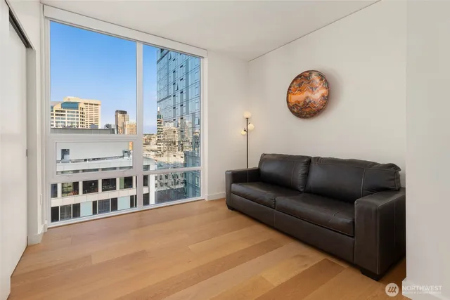 a living room with furniture and a large window