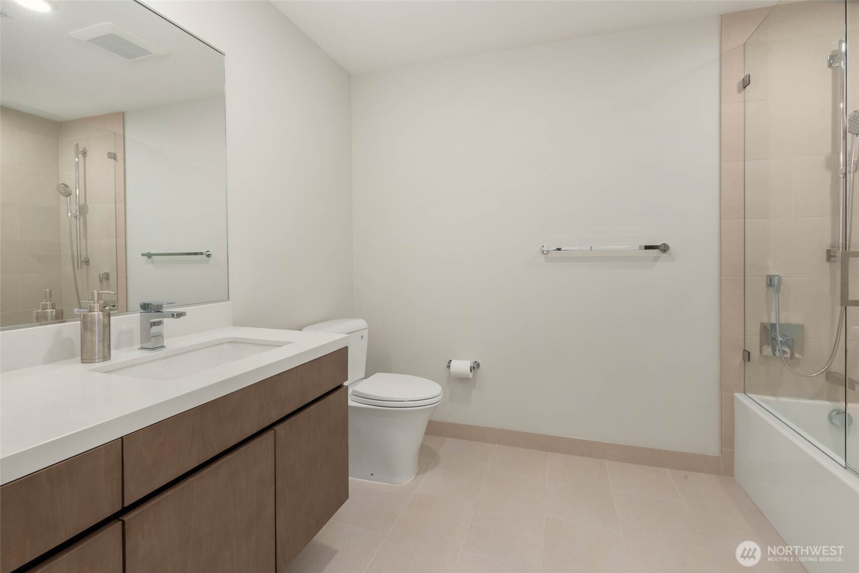 121 Stewart Street, Unit 1701 Seattle, WA 98101 - Photo 18 of 32 a bathroom with a sink a toilet and shower