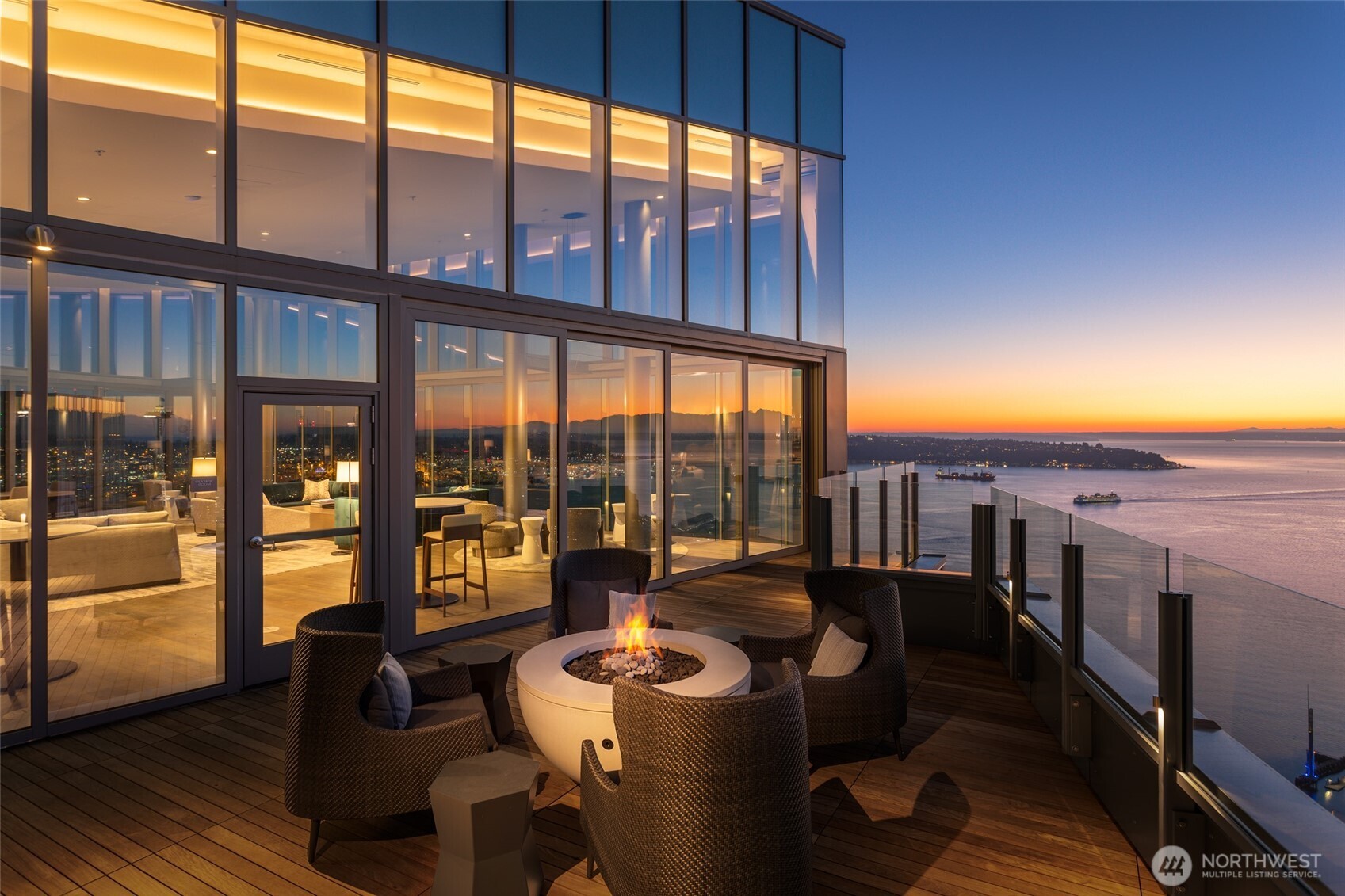 121 Stewart Street, Unit 1701 Seattle, WA 98101 - Photo 24 of 32 a living room with furniture and a floor to ceiling window