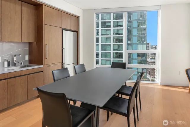 a view of a dining room with furniture and window