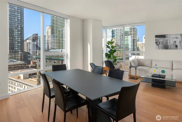 a view of a dining room with furniture and a window