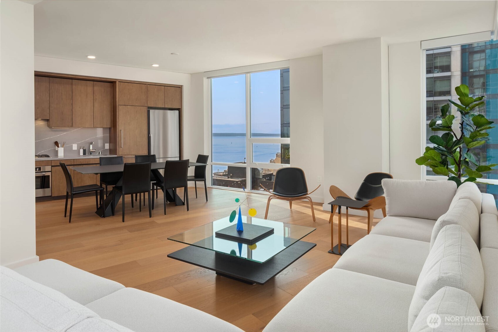 121 Stewart Street, Unit 1701 Seattle, WA 98101 - Photo 10 of 32 a living room with furniture and a large window