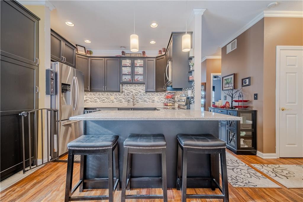 100 Patton Drive Aliquippa, PA 15001 - Photo 11 of 25 a kitchen with kitchen island granite countertop wooden cabinets and stainless steel appliances