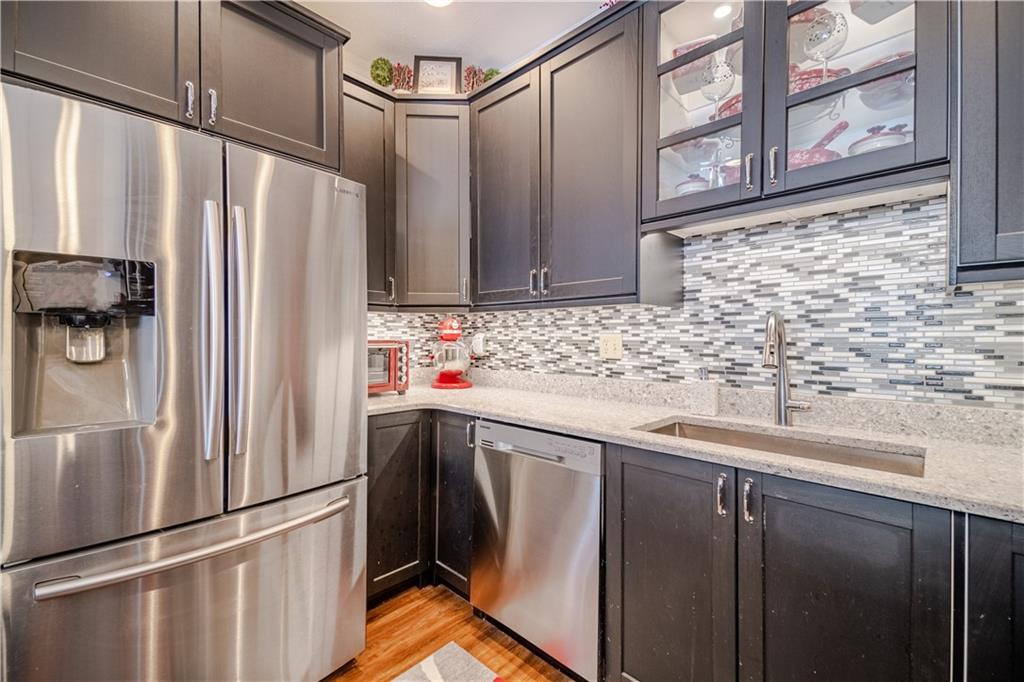 100 Patton Drive Aliquippa, PA 15001 - Photo 16 of 25 a kitchen with stainless steel appliances granite countertop a refrigerator and a sink