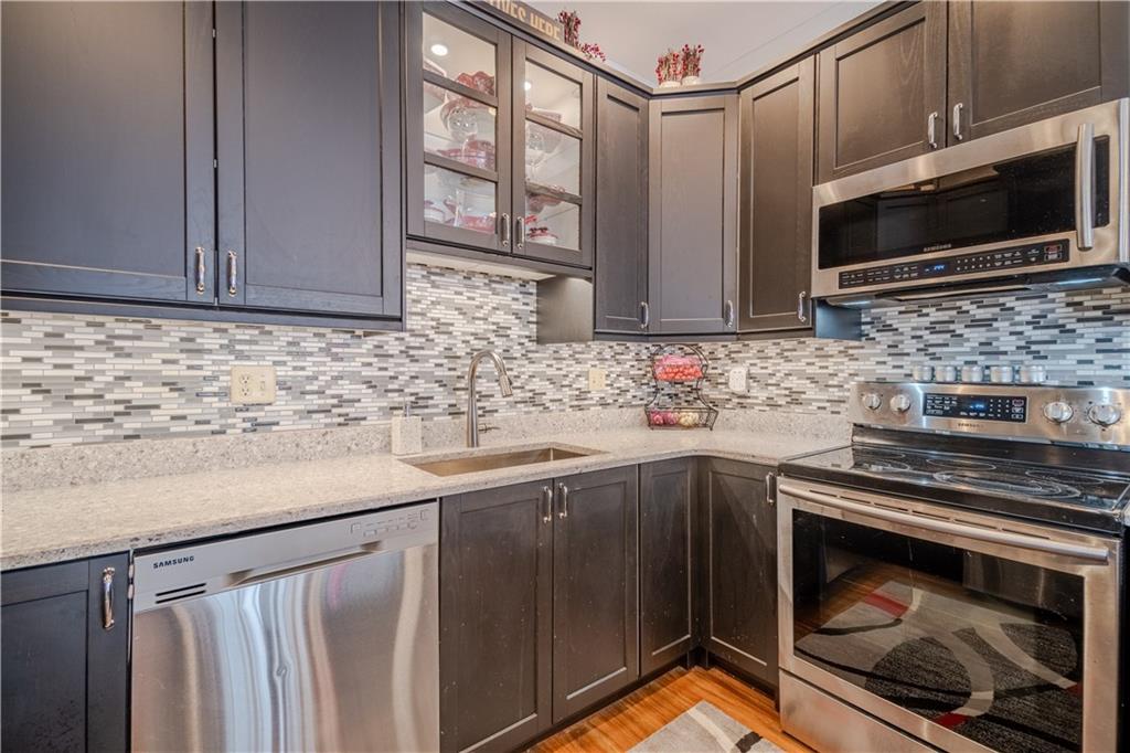 100 Patton Drive Aliquippa, PA 15001 - Photo 17 of 25 a kitchen with stainless steel appliances granite countertop a sink stove and microwave