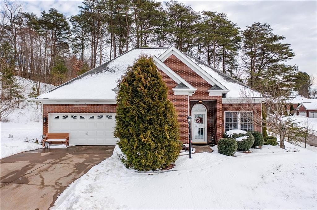 100 Patton Drive Aliquippa, PA 15001 - Photo 3 of 25 a view of a house with a yard and garage