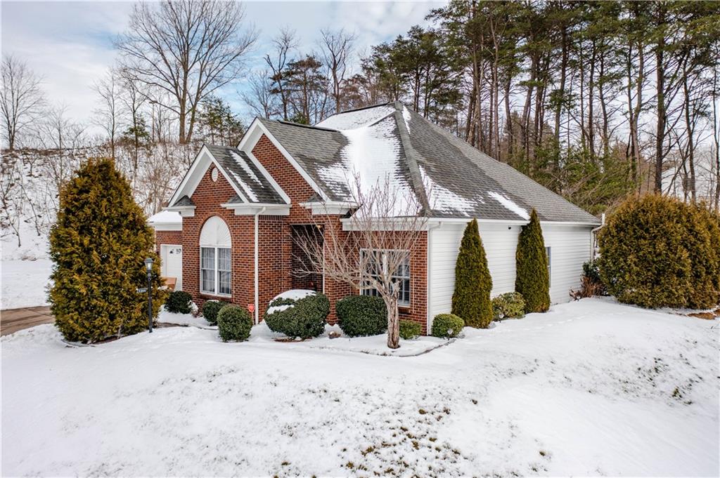 100 Patton Drive Aliquippa, PA 15001 - Photo 5 of 25 a front view of a house with a yard covered in snow