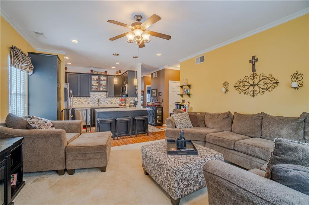 100 Patton Drive Aliquippa, PA 15001 - Photo 10 of 25 a living room with furniture and a chandelier