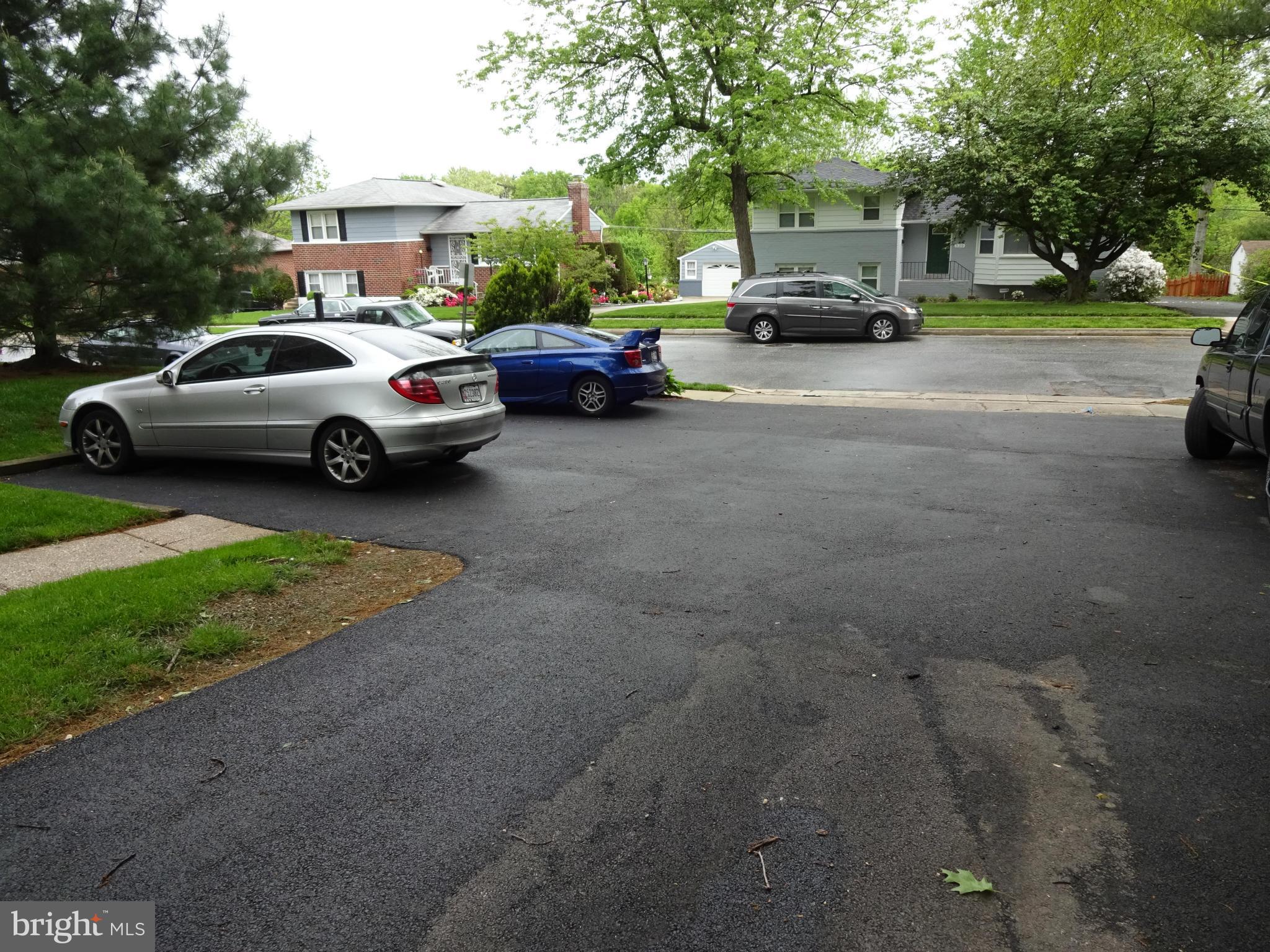 521 Epsom Road, Unit 2B Baltimore, MD 21286 - Photo 14 of 14 a view of a cars parked in front of a house