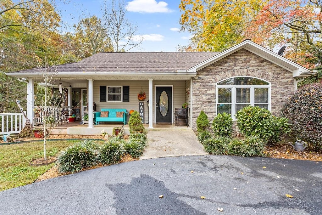 411 Heads Ferry Road Cornelia, GA 30531 - Photo 1 of 1 a front view of a house with a yard