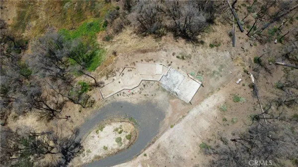 a view of a backyard of the house