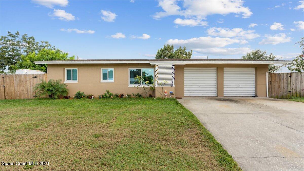 2255 King Richard Road Melbourne, FL 32935 - Photo 2 of 23 front view of house with a yard