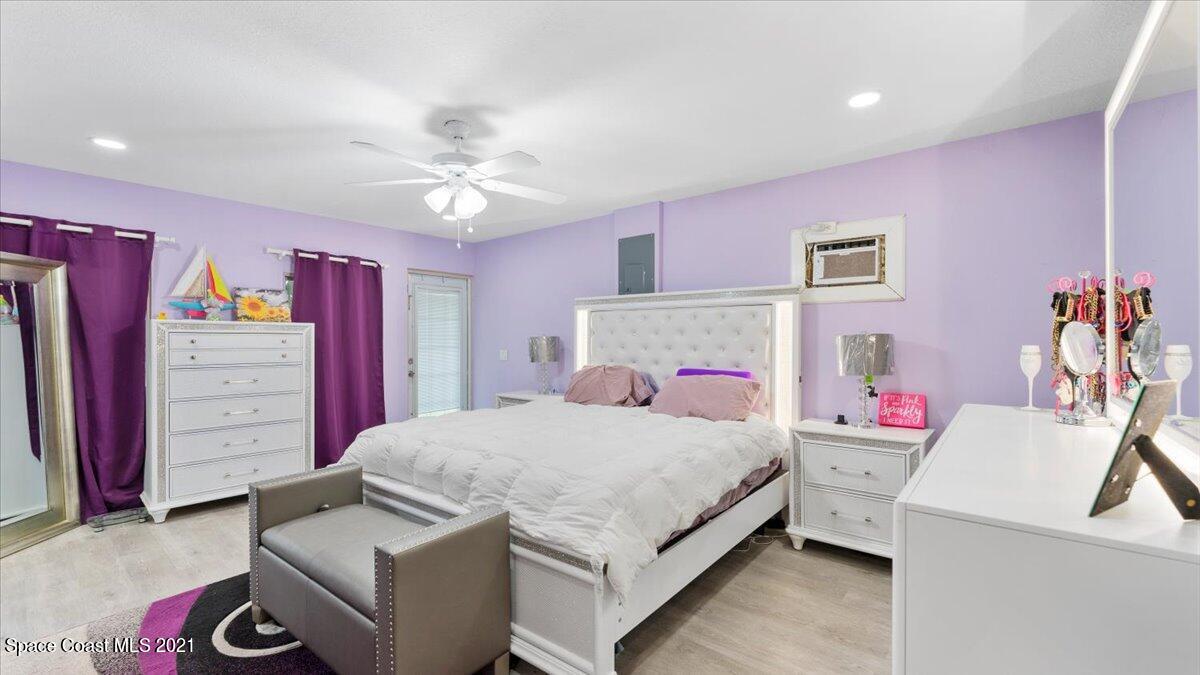 2255 King Richard Road Melbourne, FL 32935 - Photo 14 of 23 a bedroom with a bed and a dresser