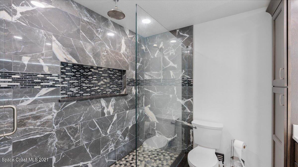 2255 King Richard Road Melbourne, FL 32935 - Photo 18 of 23 a bathroom with a toilet and a shower