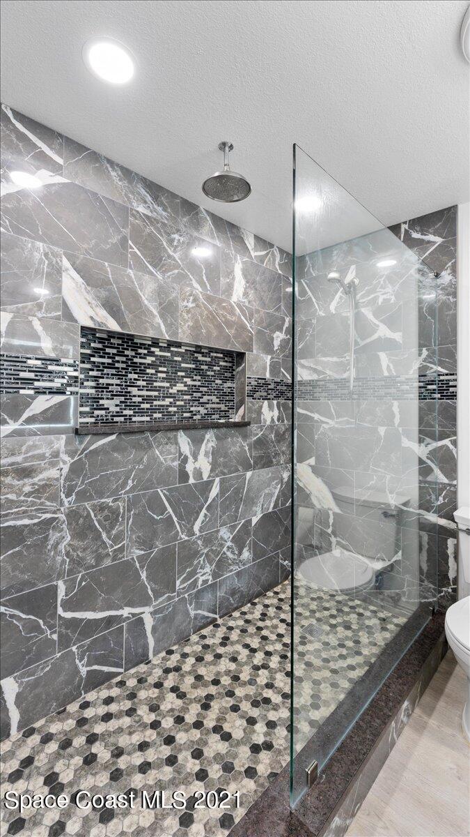 2255 King Richard Road Melbourne, FL 32935 - Photo 19 of 23 a bathroom with a shower