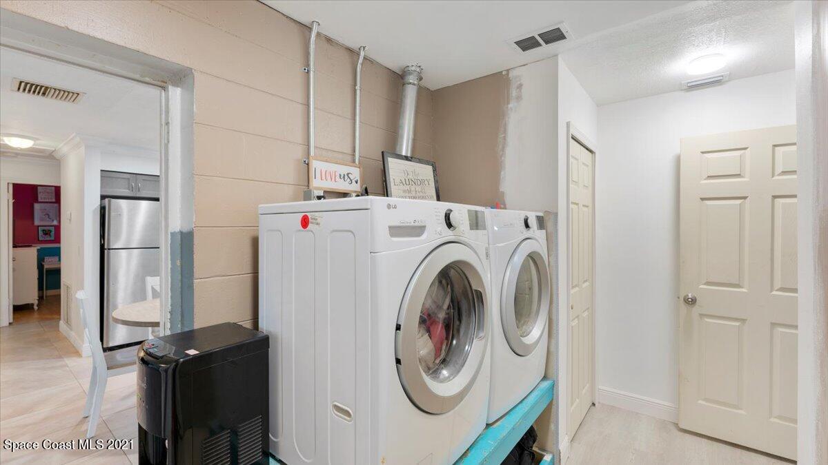 2255 King Richard Road Melbourne, FL 32935 - Photo 20 of 23 a utility room with dryer and washer