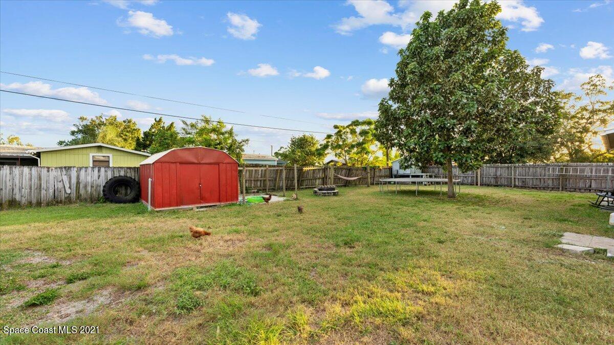 2255 King Richard Road Melbourne, FL 32935 - Photo 23 of 23 a view of backyard with green space
