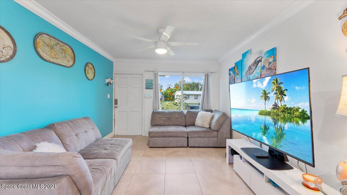2255 King Richard Road Melbourne, FL 32935 - Photo 5 of 23 a living room with furniture and a rug