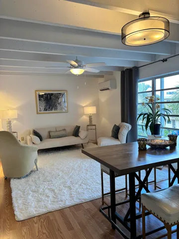 a view of a dining room with furniture and window