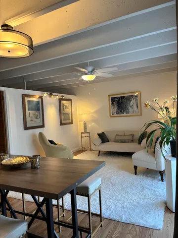 a living room with furniture and a table