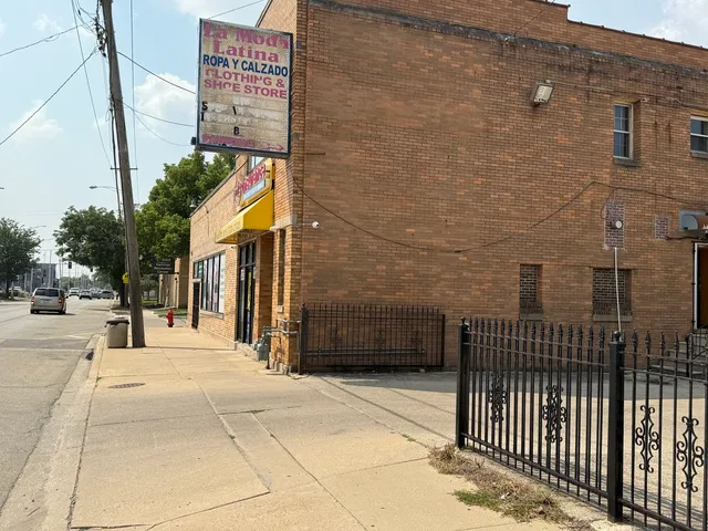 a view of a brick house with a street