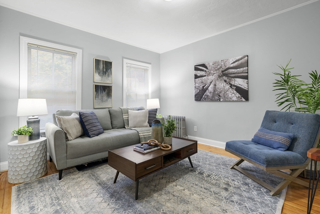 71 School Street, Unit 71 Acton, MA 01720 - Photo 12 of 38 a living room with furniture and a potted plant