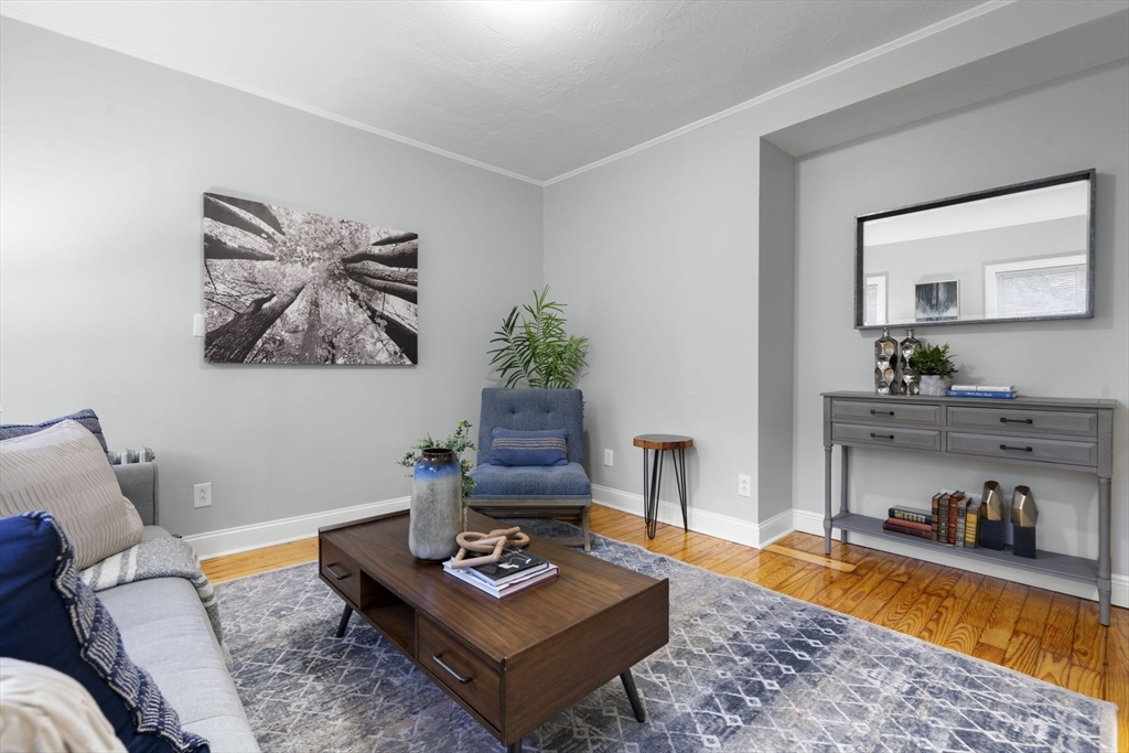 71 School Street, Unit 71 Acton, MA 01720 - Photo 13 of 38 a living room with furniture and a couch