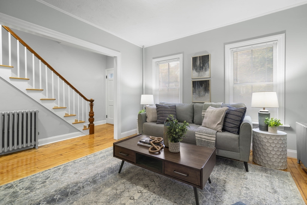 71 School Street, Unit 71 Acton, MA 01720 - Photo 14 of 38 a living room with furniture and a potted plant