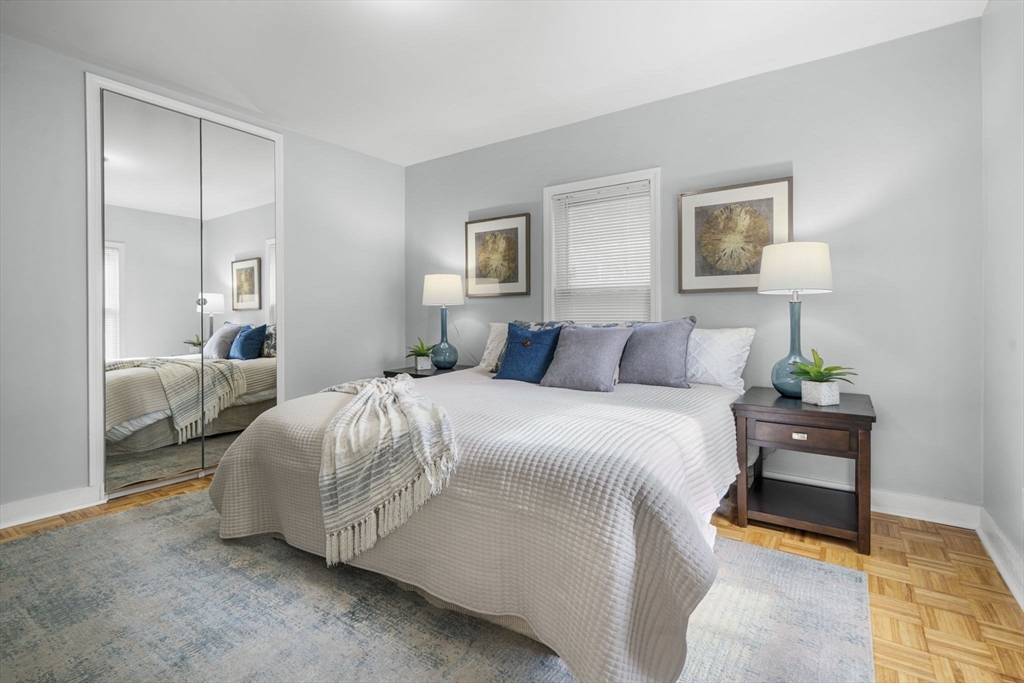 71 School Street, Unit 71 Acton, MA 01720 - Photo 21 of 38 a bedroom with a bed and a night stand