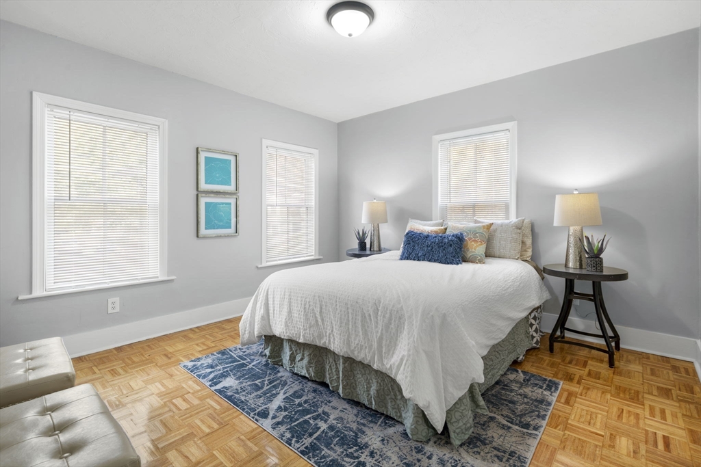 71 School Street, Unit 71 Acton, MA 01720 - Photo 25 of 38 a bedroom with a bed and a window