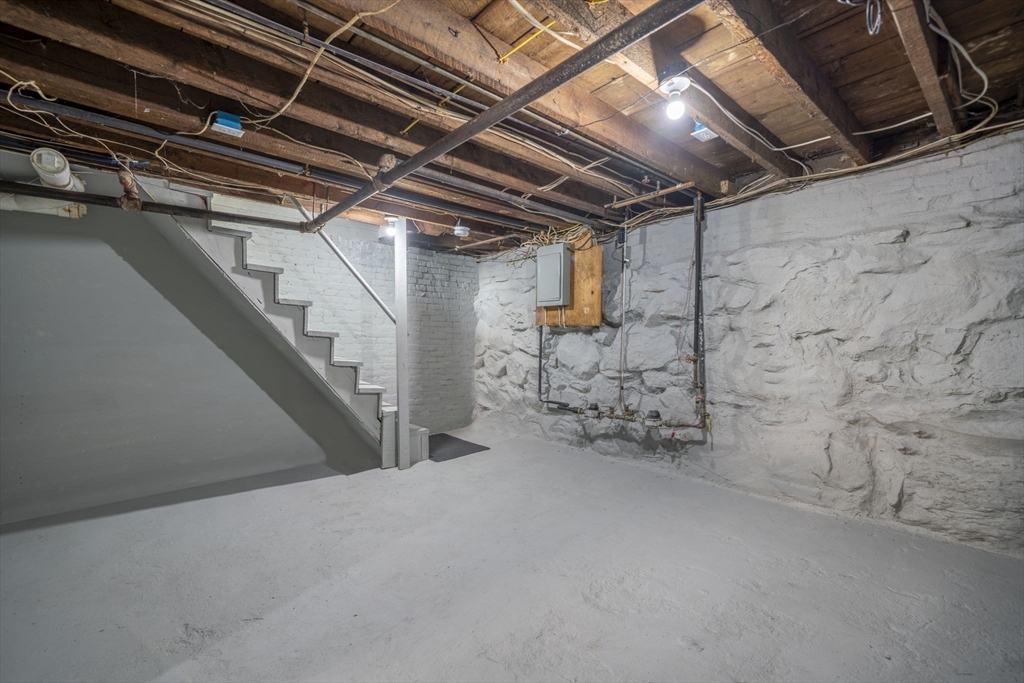 71 School Street, Unit 71 Acton, MA 01720 - Photo 31 of 38 a view of empty room with wooden ceiling