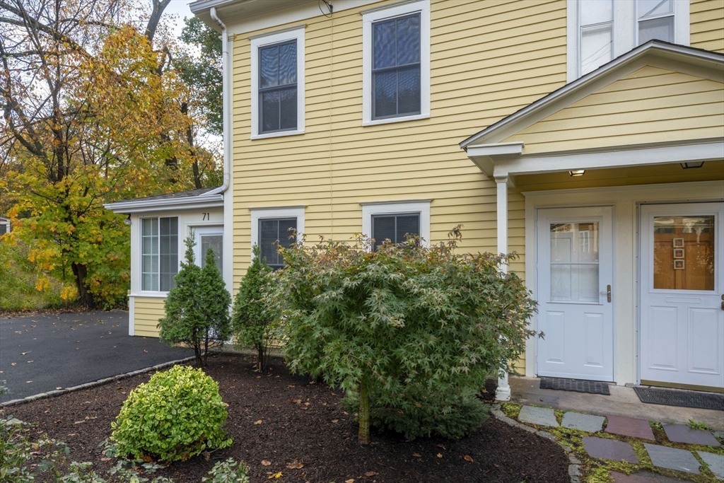 71 School Street, Unit 71 Acton, MA 01720 - Photo 34 of 38 a front view of a house with garden