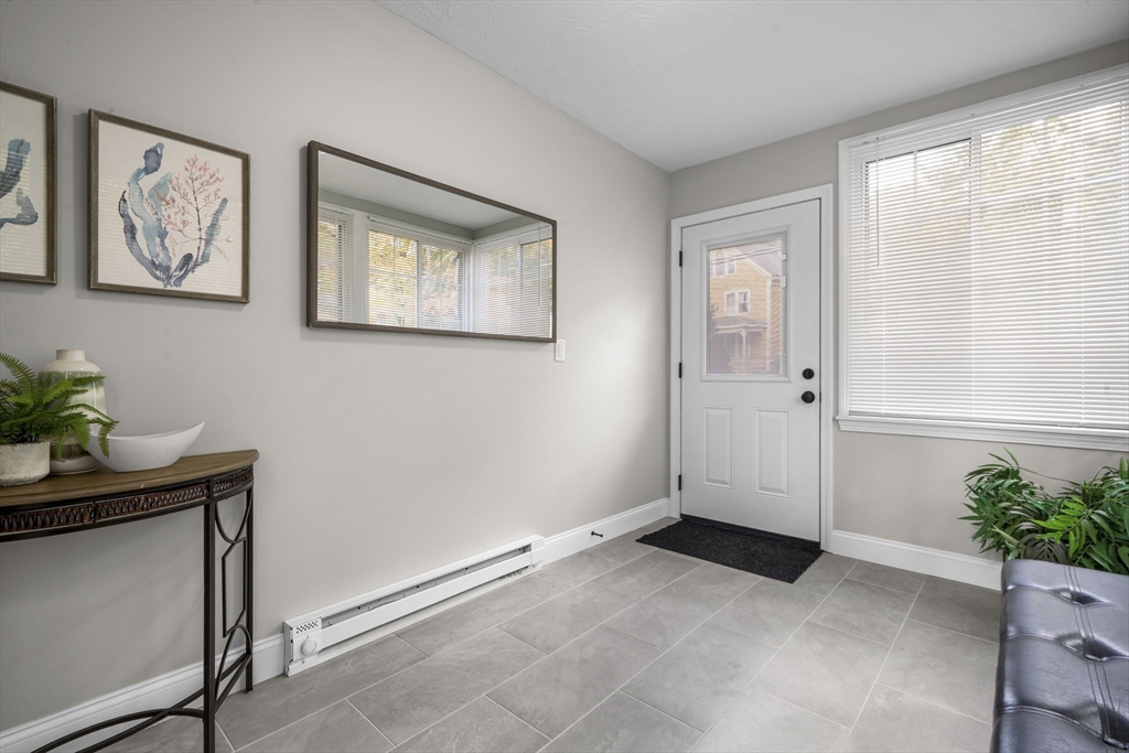 71 School Street, Unit 71 Acton, MA 01720 - Photo 4 of 38 a view of room with window and potted plant