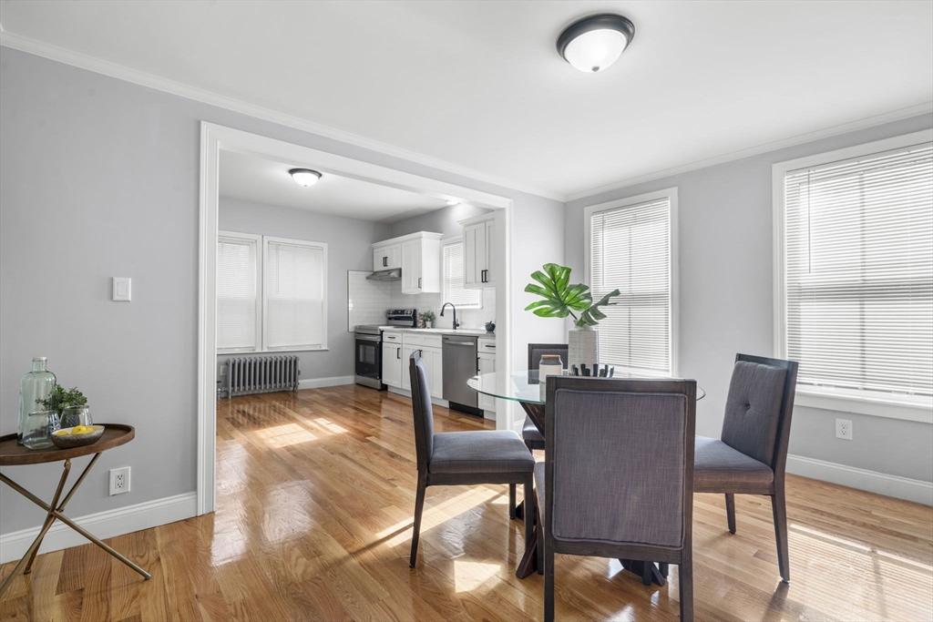 71 School Street, Unit 71 Acton, MA 01720 - Photo 10 of 38 a view of a dining room with furniture and a window