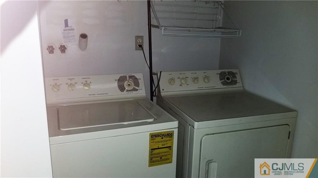 17 Ash Road Edison, NJ 08817 - Photo 12 of 19 a utility room with dryer and washer