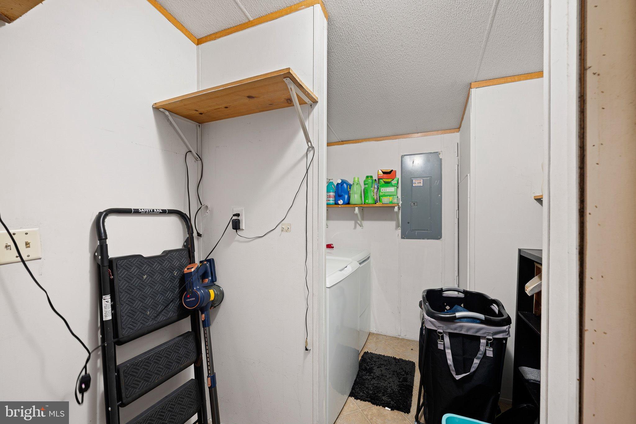 1650 Cypress Branch Road Magnolia, DE 19962 - Photo 31 of 35 Functional laundry space with organized storage.