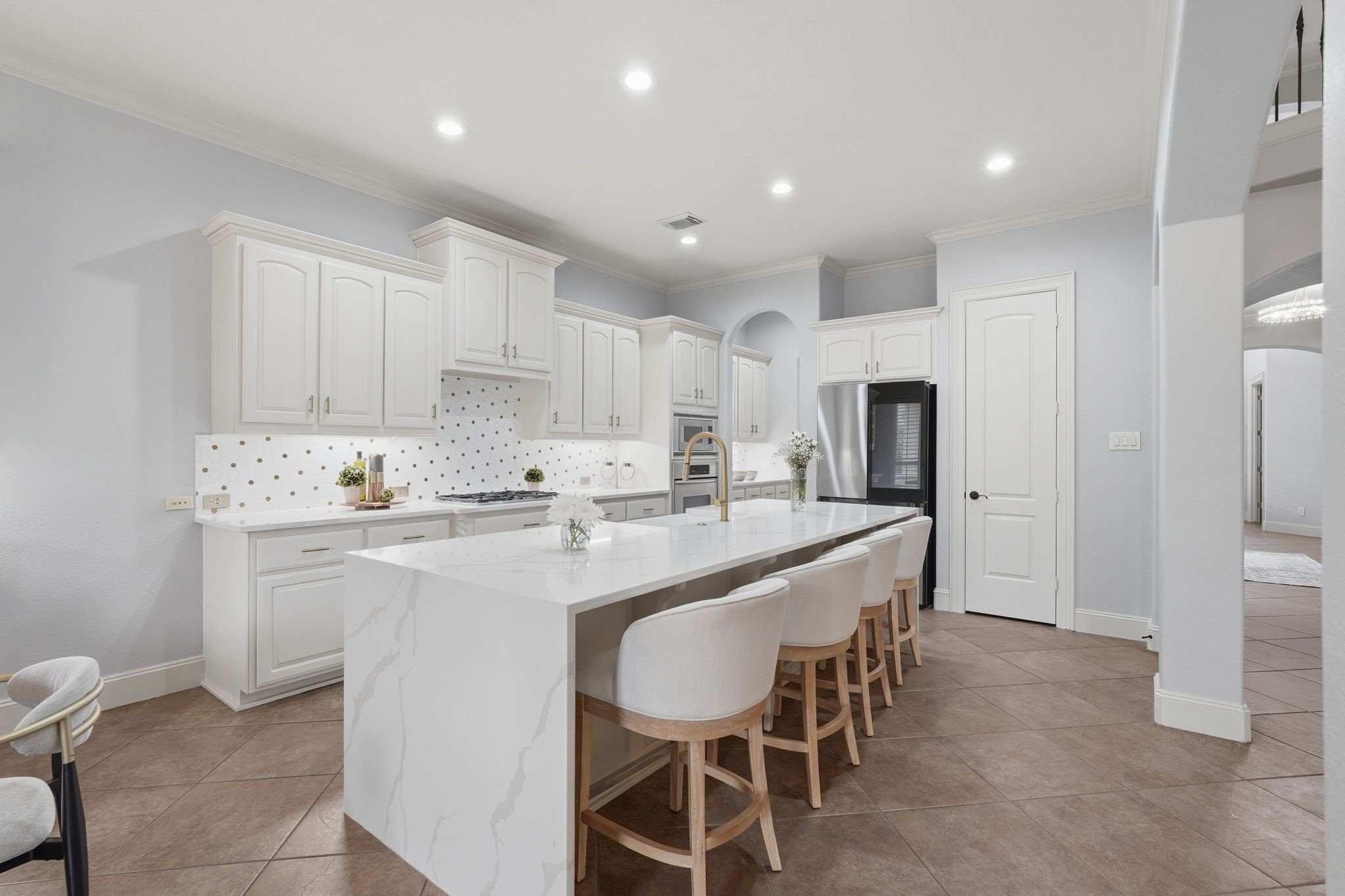 7603 Hogan Bridge Court Spring, TX 77389 - Photo 11 of 50 The heart of the home, this kitchen showcases quartz waterfall countertops.