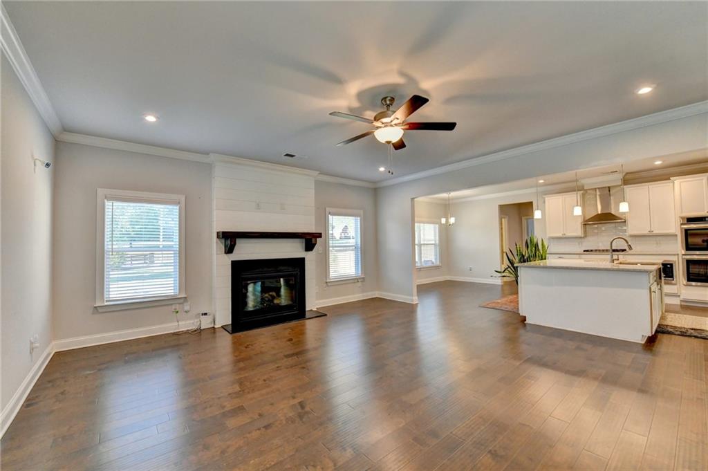 4548 Red Blossom Trail Southwest Powder Springs, GA 30127 - Photo 17 of 72 a view of an empty room with a fireplace and a window