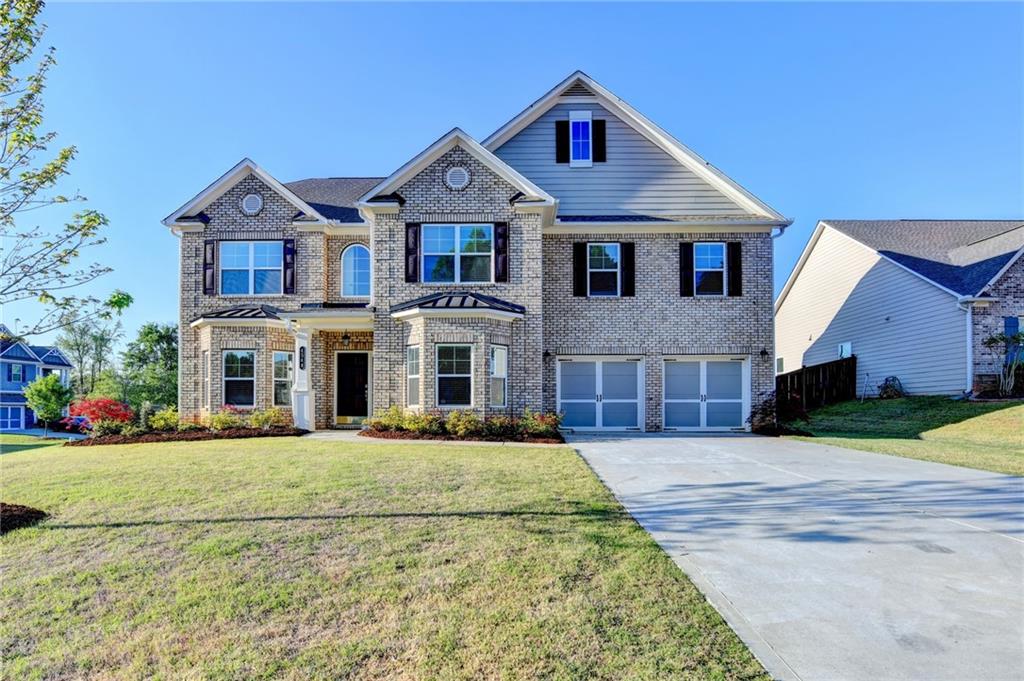 4548 Red Blossom Trail Southwest Powder Springs, GA 30127 - Photo 2 of 72 a front view of house with yard