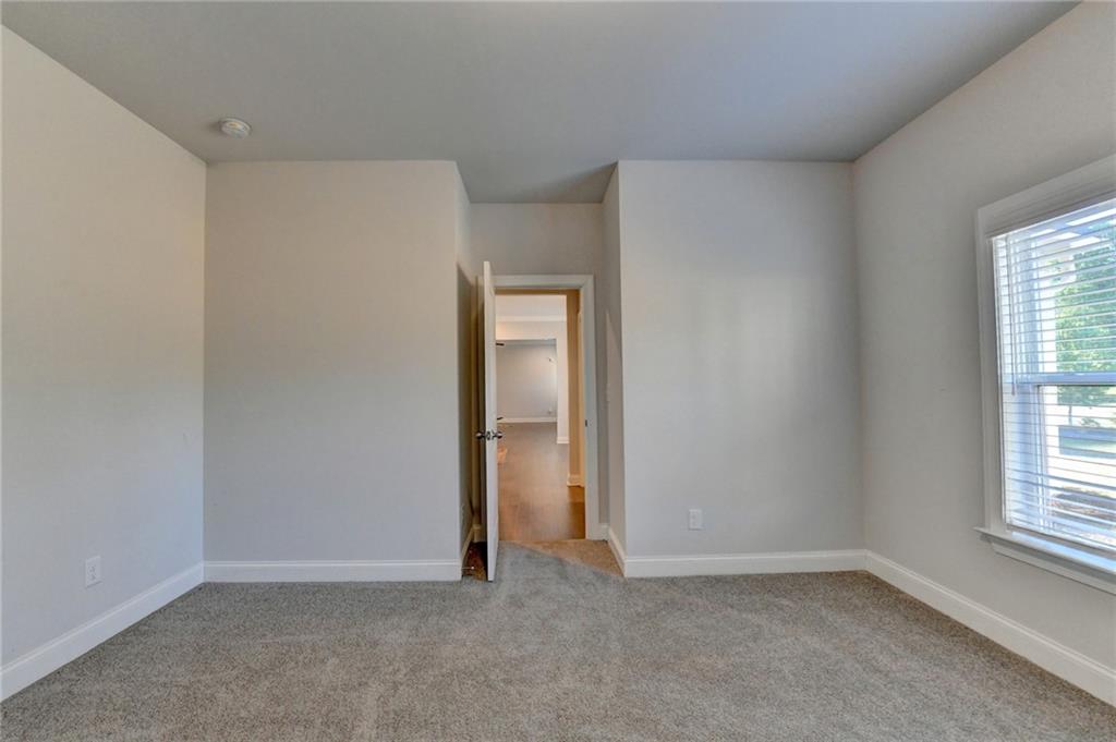 4548 Red Blossom Trail Southwest Powder Springs, GA 30127 - Photo 34 of 72 an empty room with windows