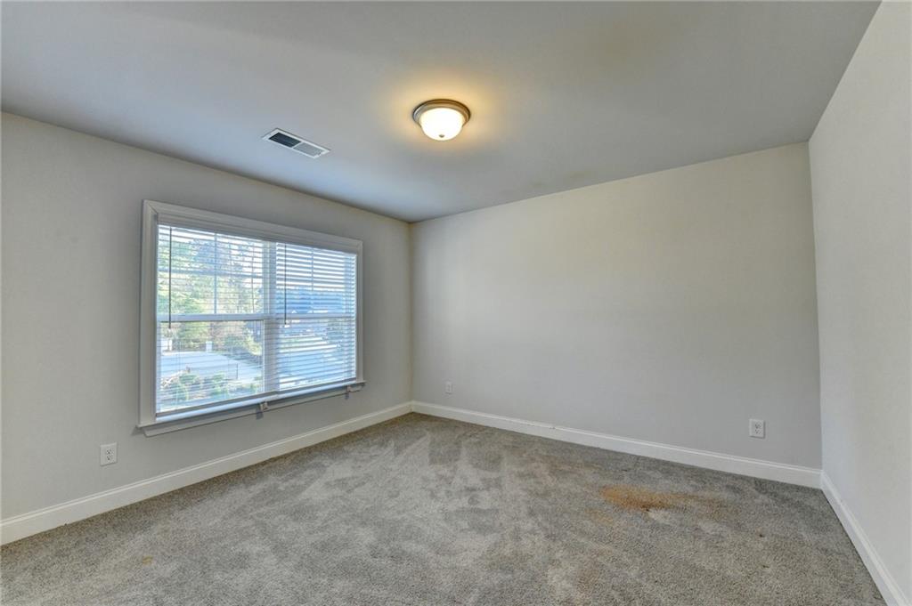 4548 Red Blossom Trail Southwest Powder Springs, GA 30127 - Photo 38 of 72 an empty room with a window