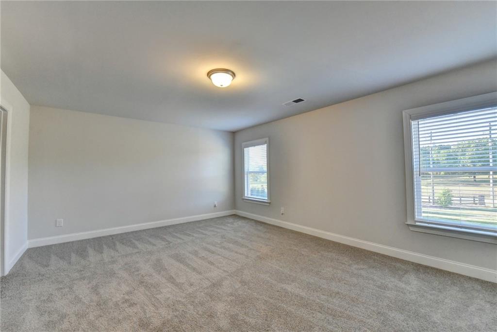 4548 Red Blossom Trail Southwest Powder Springs, GA 30127 - Photo 41 of 72 an empty room with a window