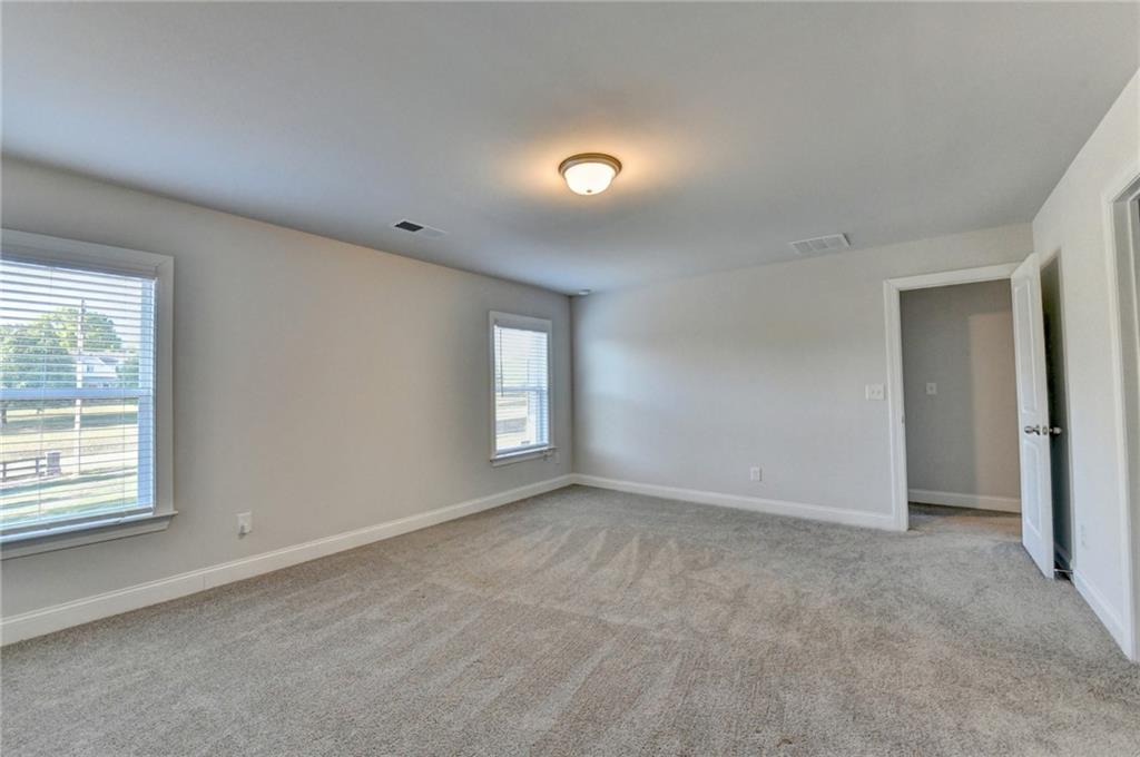 4548 Red Blossom Trail Southwest Powder Springs, GA 30127 - Photo 43 of 72 a view of an empty room with a window