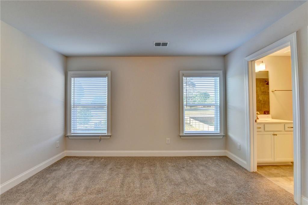 4548 Red Blossom Trail Southwest Powder Springs, GA 30127 - Photo 47 of 72 an empty room with windows