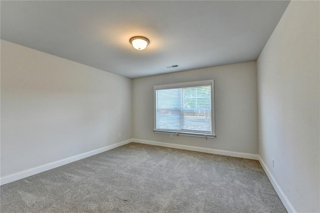 4548 Red Blossom Trail Southwest Powder Springs, GA 30127 - Photo 49 of 72 an empty room with a window
