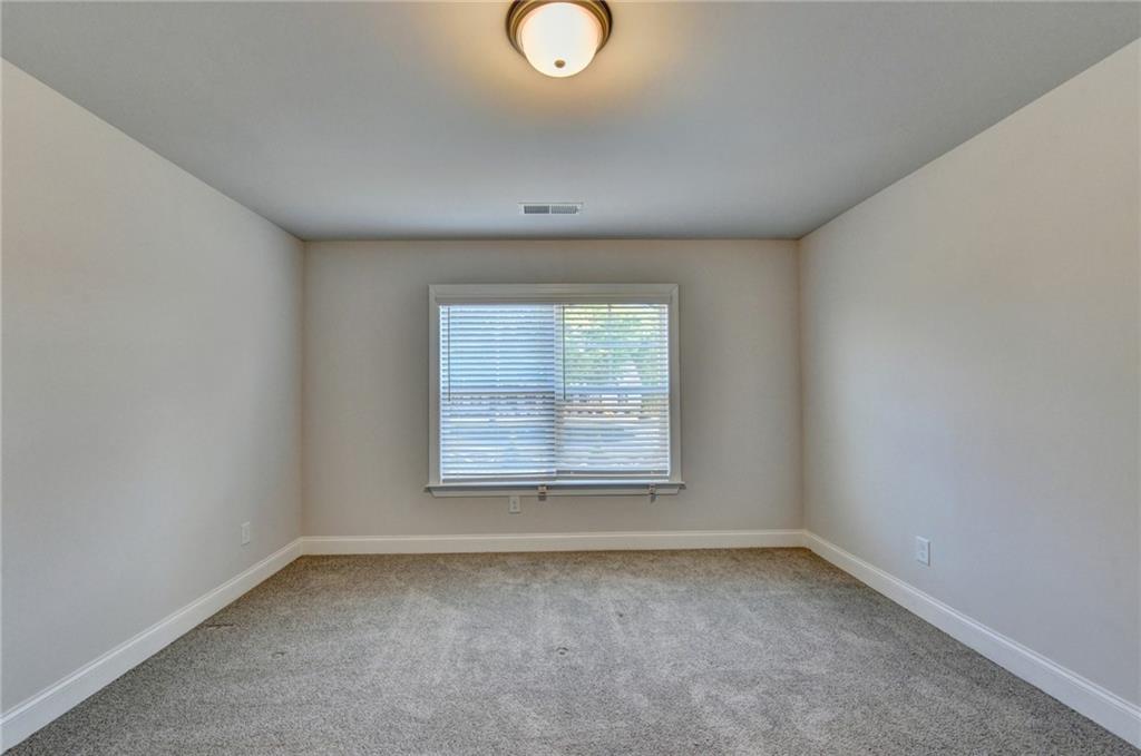 4548 Red Blossom Trail Southwest Powder Springs, GA 30127 - Photo 50 of 72 an empty room with a window