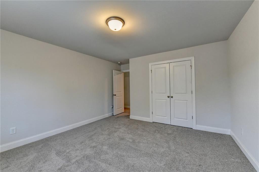 4548 Red Blossom Trail Southwest Powder Springs, GA 30127 - Photo 51 of 72 a view of an empty room and a window