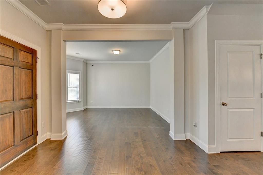 4548 Red Blossom Trail Southwest Powder Springs, GA 30127 - Photo 6 of 72 wooden floor in an empty room