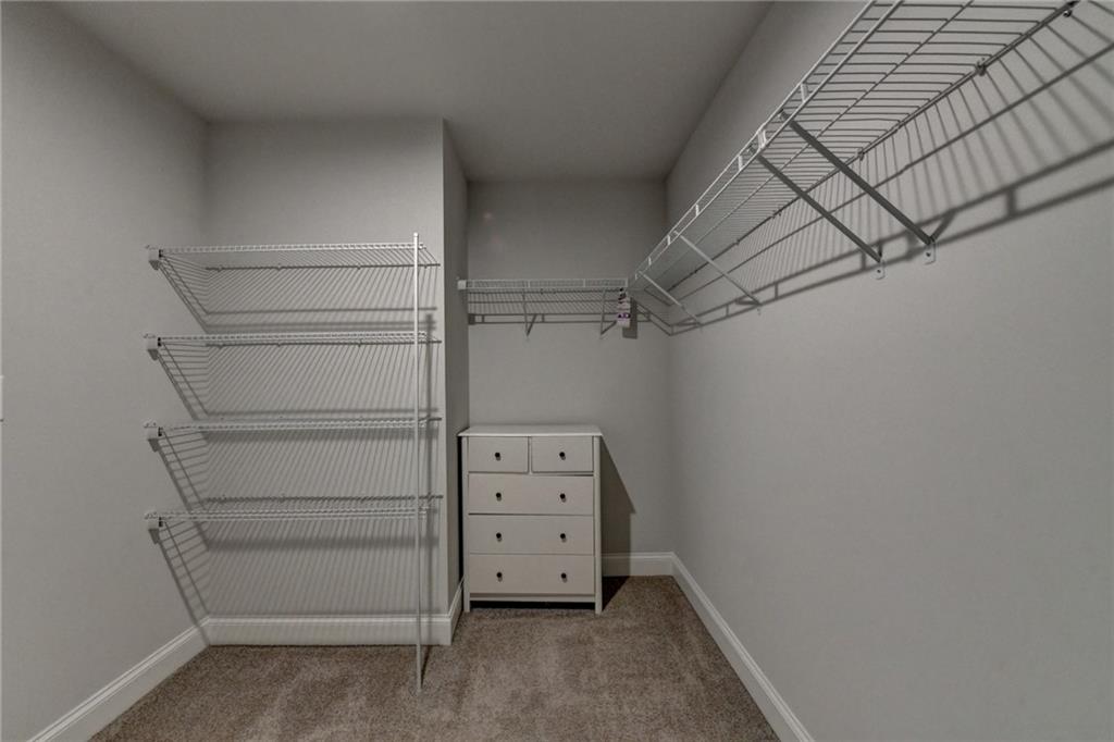 4548 Red Blossom Trail Southwest Powder Springs, GA 30127 - Photo 63 of 72 a view of walk in closet